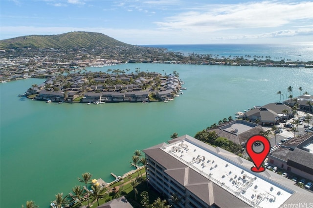 birds eye view of property featuring a water and mountain view