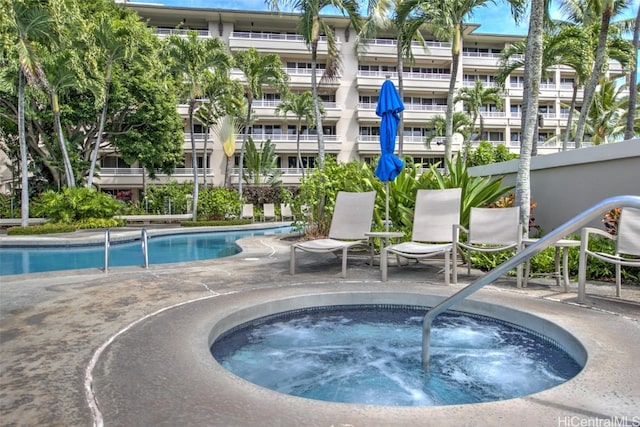 view of pool with a community hot tub