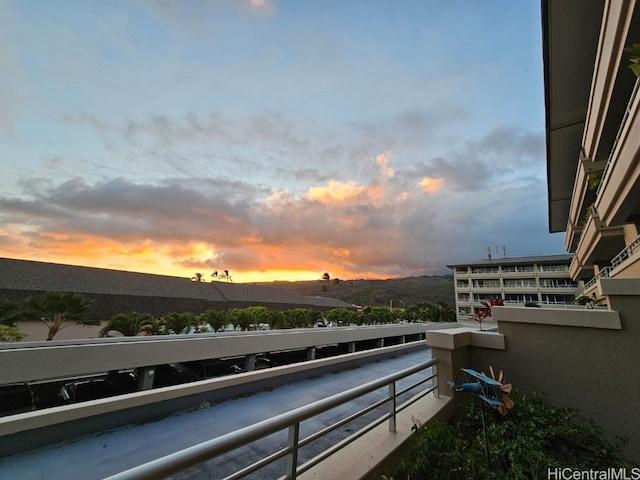 balcony at dusk with a mountain view