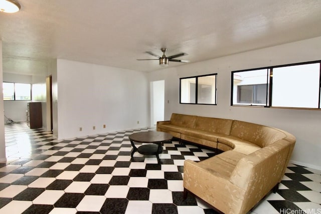 unfurnished living room featuring ceiling fan