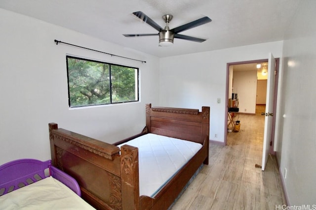 bedroom featuring ceiling fan and light wood-type flooring