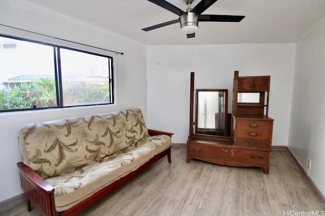 sitting room with light hardwood / wood-style flooring and ceiling fan