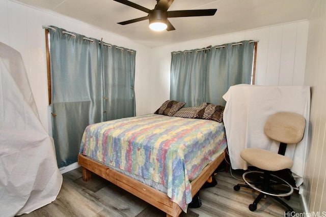 bedroom featuring ceiling fan and wood-type flooring