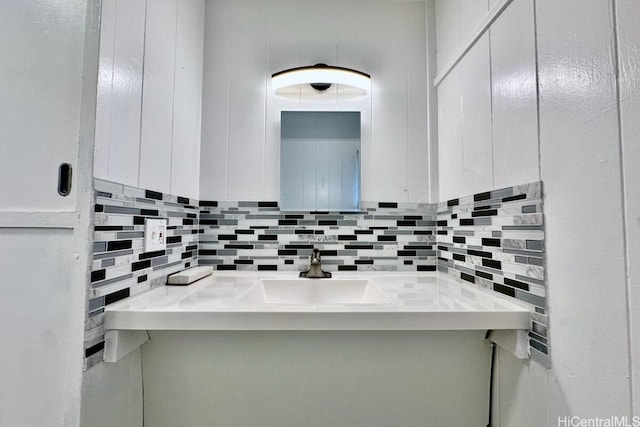 bathroom with vanity and backsplash