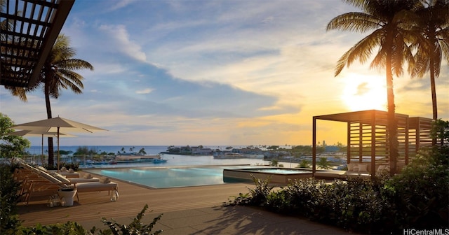 pool at dusk with a water view