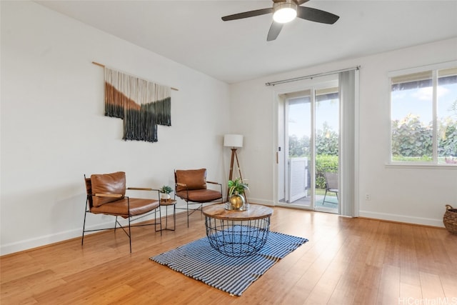 sitting room featuring ceiling fan and light hardwood / wood-style floors