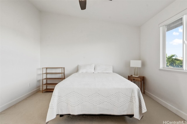 bedroom with light colored carpet and ceiling fan