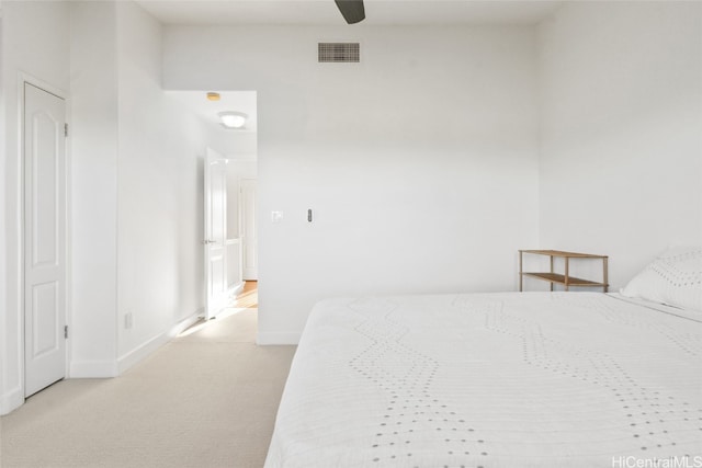 unfurnished bedroom featuring light carpet and ceiling fan