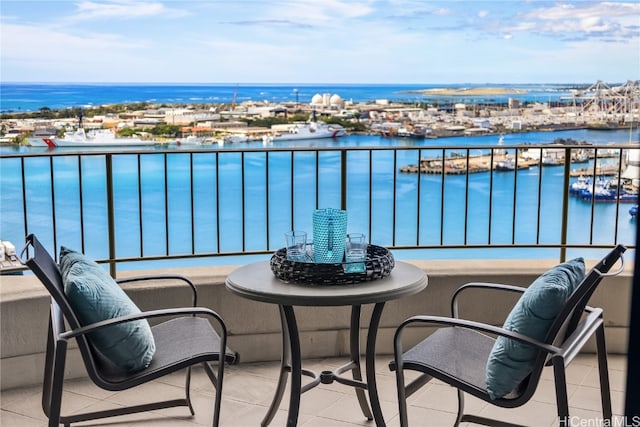 balcony featuring a water view