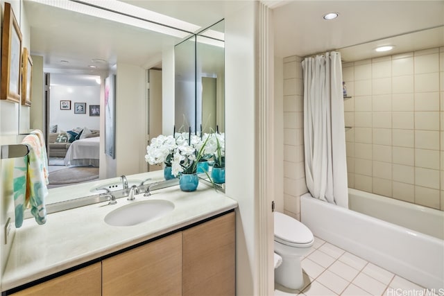 full bathroom featuring tile patterned flooring, vanity, toilet, and shower / tub combo