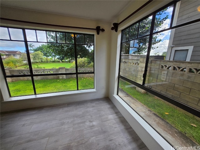 unfurnished sunroom with a wealth of natural light