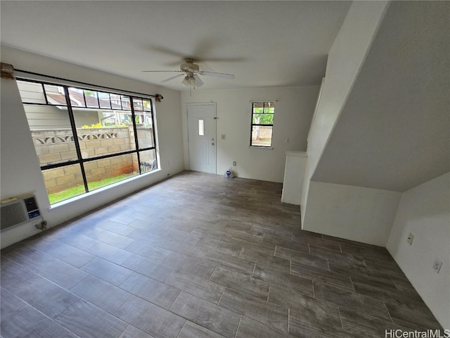 interior space with ceiling fan