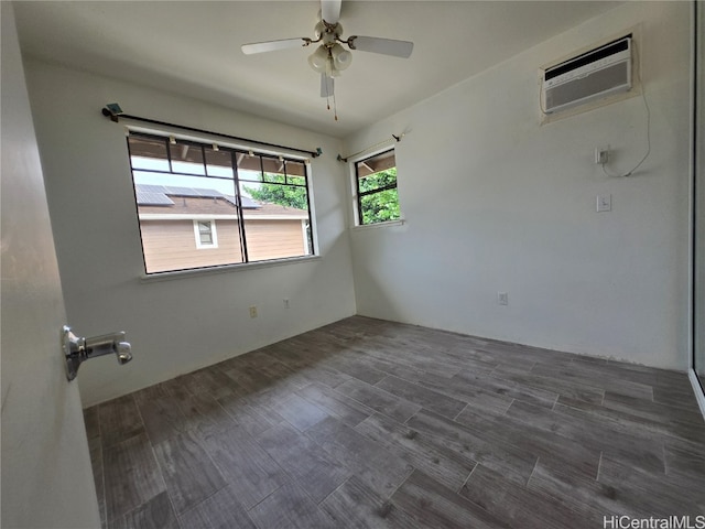 unfurnished room featuring ceiling fan, dark hardwood / wood-style flooring, and an AC wall unit