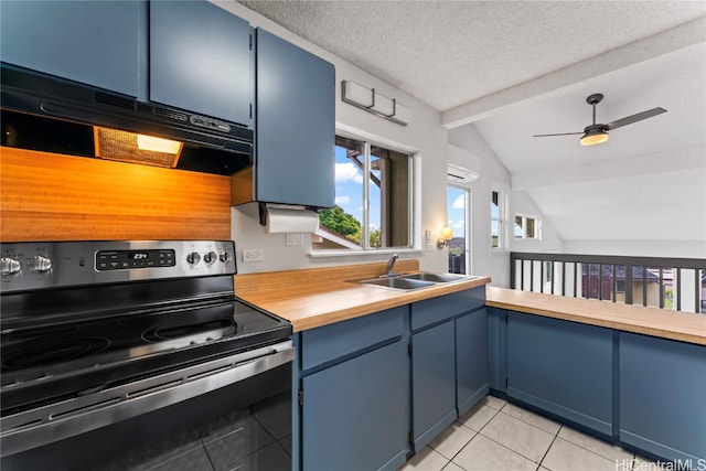 kitchen with stainless steel electric range, lofted ceiling with beams, ceiling fan, a textured ceiling, and light tile patterned flooring