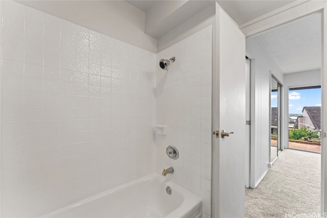 bathroom with tiled shower / bath combo