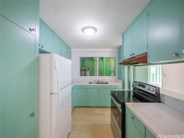 kitchen with sink, stainless steel electric stove, and white fridge