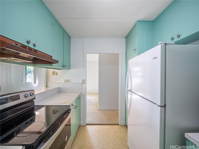 kitchen with white refrigerator and stainless steel electric stove