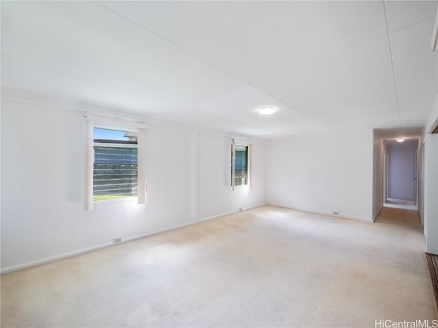 unfurnished room with light colored carpet