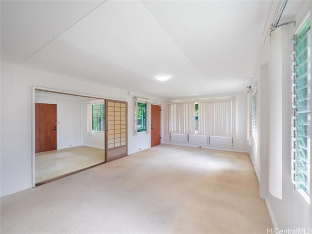 empty room featuring light colored carpet