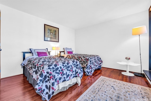 bedroom featuring wood finished floors