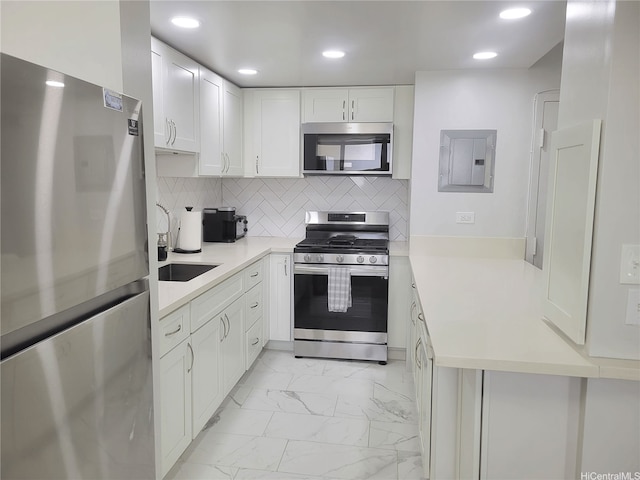 2465 Kuhio Ave Unit 1102, Honolulu, HI 96815 - kitchen featuring appliances with stainless steel finishes, electric panel, light marble finish flooring, light countertops, and recessed lighting