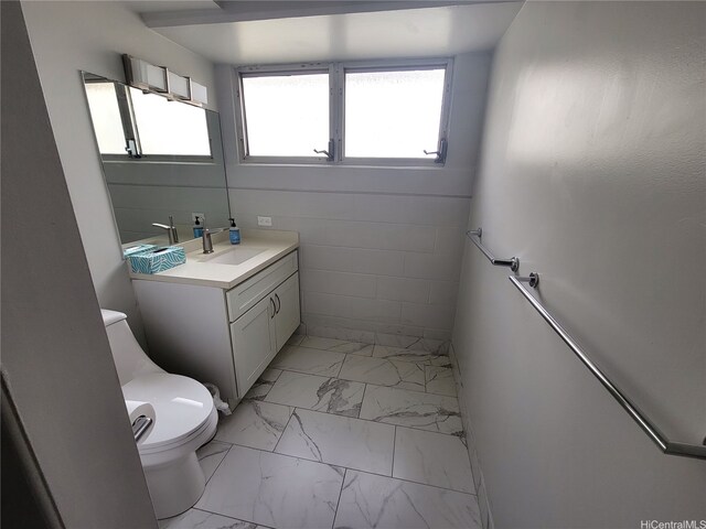 2465 Kuhio Ave Unit 1102, Honolulu, HI 96815 - bathroom with marble finish flooring, toilet, and vanity