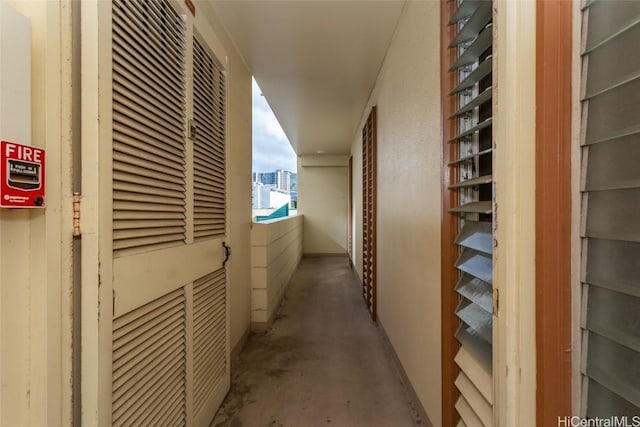 hall featuring concrete flooring