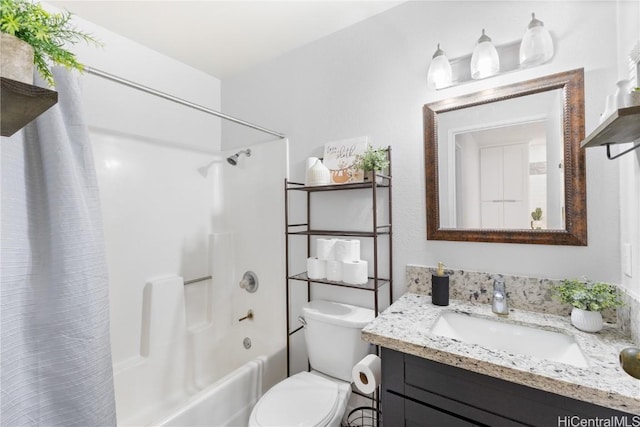 full bathroom with shower / tub combo with curtain, vanity, and toilet