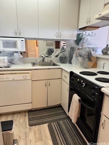 kitchen featuring sink, dark hardwood / wood-style flooring, white appliances, and range hood