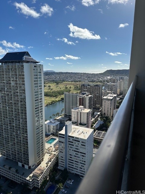 property's view of city featuring a water and mountain view