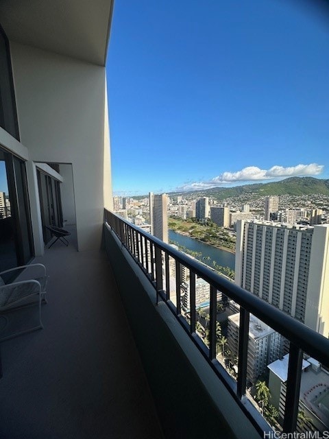 balcony with a water and mountain view