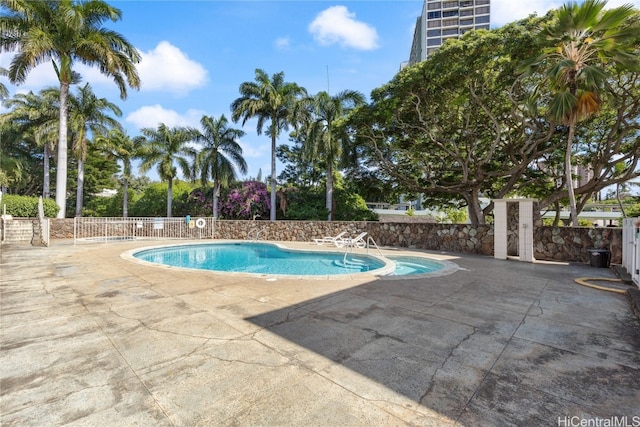 view of swimming pool featuring a patio area