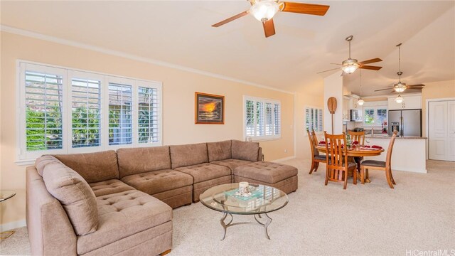 carpeted living room with crown molding and a healthy amount of sunlight