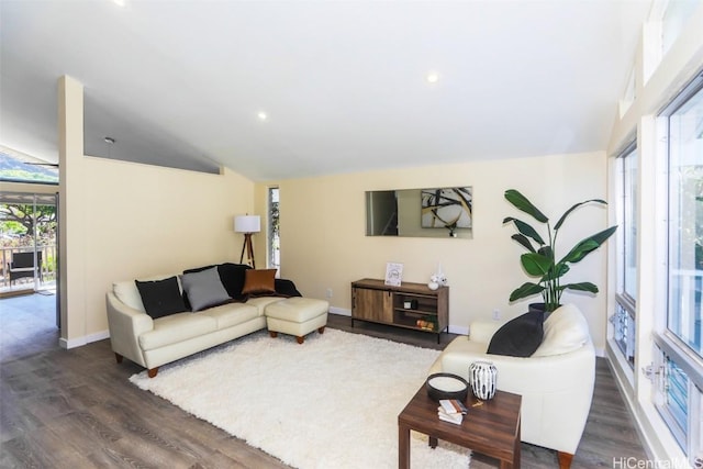 living room with dark hardwood / wood-style floors and vaulted ceiling