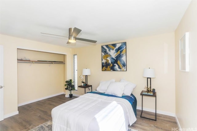 bedroom featuring ceiling fan, dark hardwood / wood-style flooring, and a closet