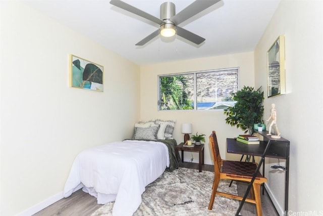 bedroom featuring ceiling fan and hardwood / wood-style floors