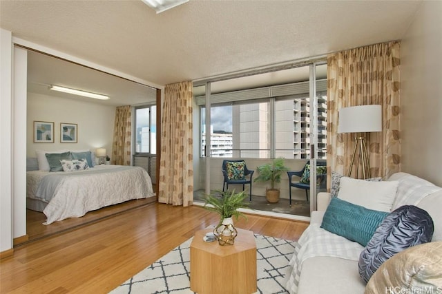 780 Amana St Unit 1506, Honolulu, HI 96814 - bedroom with a textured ceiling and wood finished floors