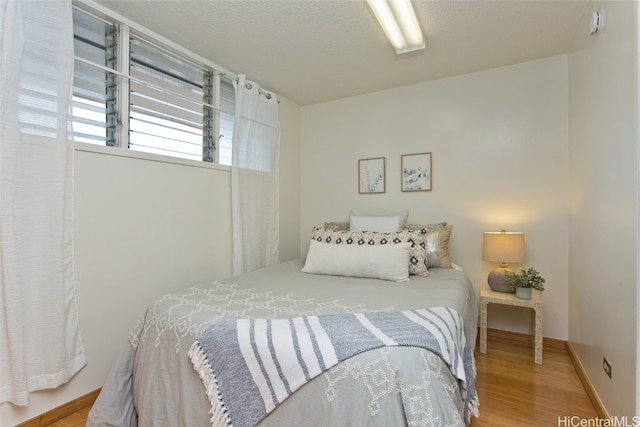 bedroom featuring hardwood / wood-style floors