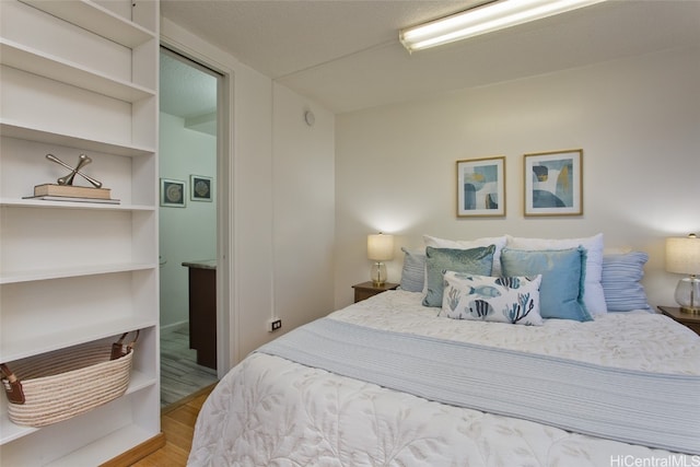 bedroom featuring hardwood / wood-style floors