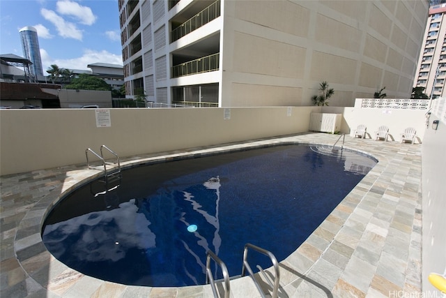 view of pool featuring a patio