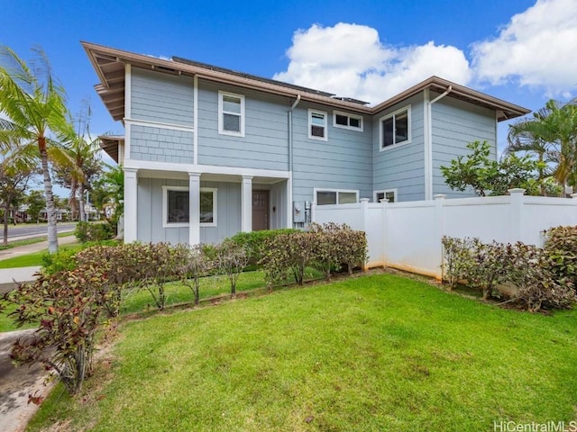 rear view of house with a yard