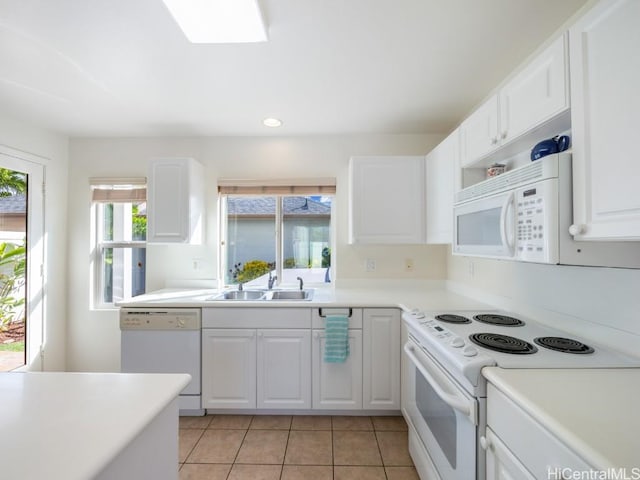 kitchen featuring white cabinets, white appliances, and sink