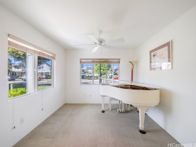 carpeted office with ceiling fan