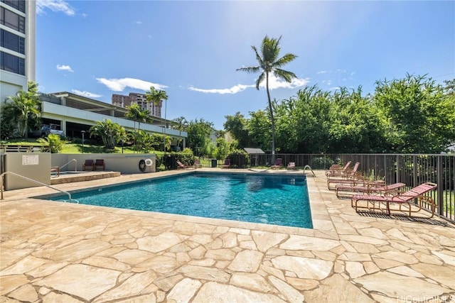 view of swimming pool featuring a patio area