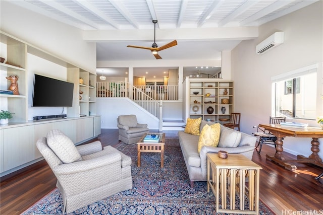 living room with dark hardwood / wood-style floors, beam ceiling, an AC wall unit, and ceiling fan