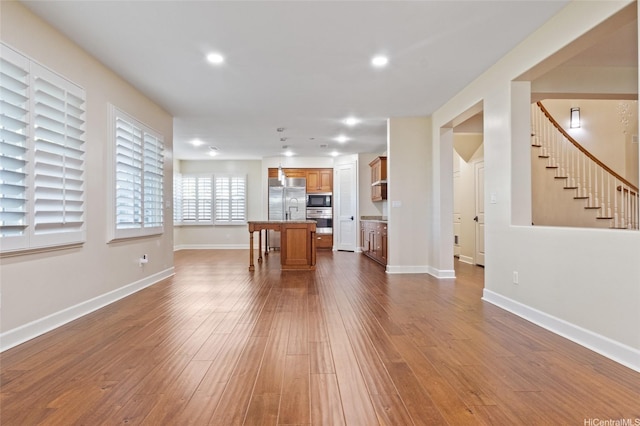91-1044 Kai Oio St, Ewa Beach, HI 96706 - living room with stairs, dark wood-type flooring, baseboards, and recessed lighting