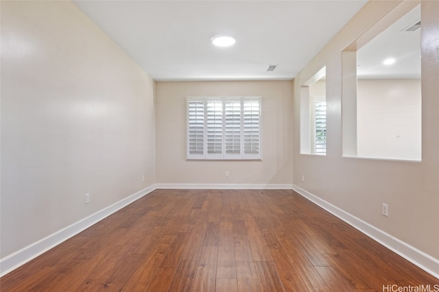 empty room featuring wood-type flooring