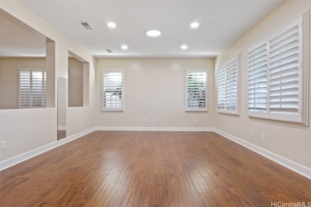 spare room featuring hardwood / wood-style floors