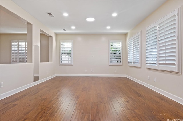 91-1044 Kai Oio St, Ewa Beach, HI 96706 - empty room featuring plenty of natural light, dark wood-type flooring, baseboards, and recessed lighting