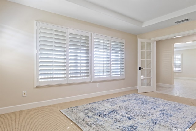 interior space featuring french doors and light colored carpet